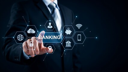 Fototapeta premium Digital Banking Concept: A businessman in a sharp suit interacts with a glowing digital interface, touching the word BANKING surrounded by icons representing financial services, clouds.