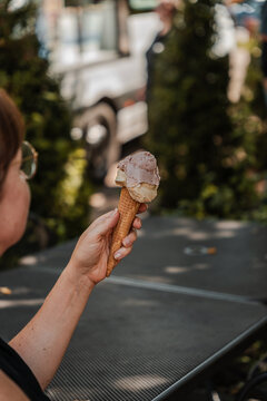 Hand holding ice cream cone