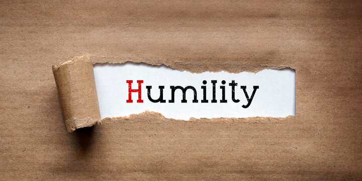 Humility - torn strip of brown kraft paper