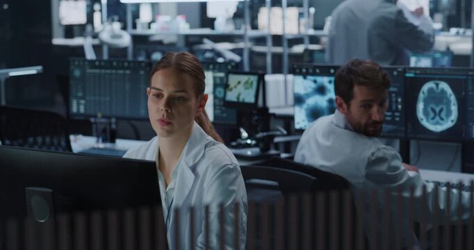Portrait of Female Scientist Analyzes Neurological Brain Scan Data on Computer Displays as Male Colleagues Work in Medical Laboratory, Applying AI Technology for Drug Development and Disease Treatment