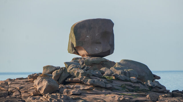 giant balancing pink granite rock formation on the coast of tregastel in brittany