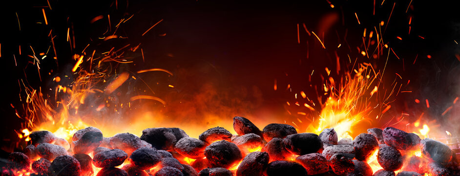 Barbecue -  Charcoal In Briquettes - Bbq - Fire And Flame Embers Glowing In Black With Abstract Sparks