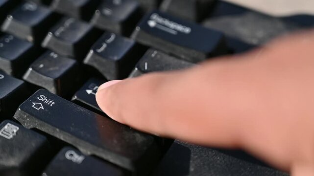 Close Up of a Human Finger Pressing the Enter Key on a Computer Keyboard While Typing &ndash; Technology, Office Work and Digital Communication Concept