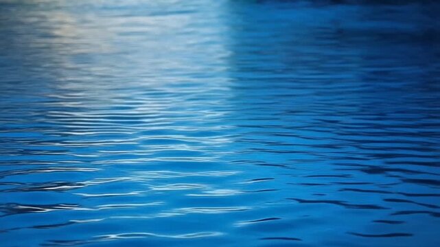 Cinematic parallax shot featuring sharp water ripples foreground and shimmering midground reflection