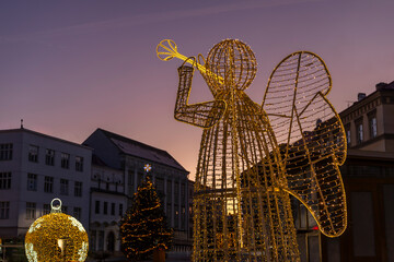Obraz premium Illuminated angel decoration and Christmas tree in Znojmo