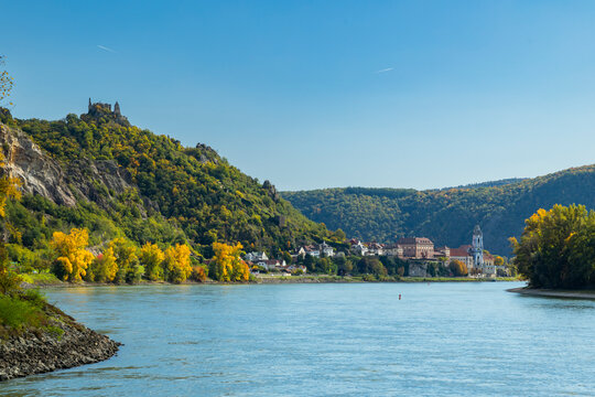 Durnstein town along Danube River with autumn trees