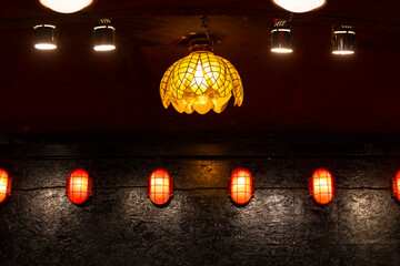 Obraz premium Illuminated lamps creating warm ambiance in dark interior