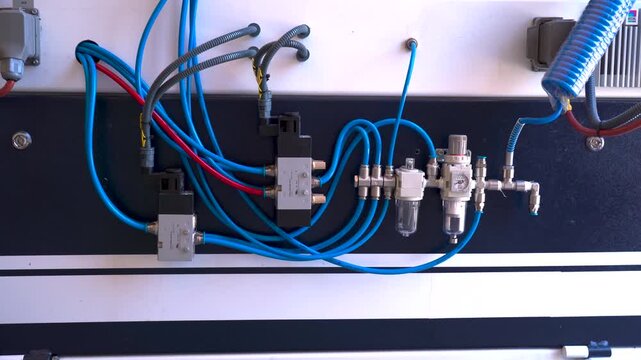 Industrial pneumatic system with solenoid valves and compressed air manifold