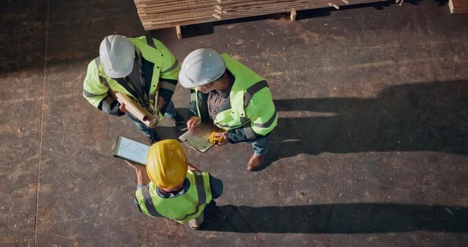 Team, above and tablet in timber factory with conversation, blueprint and clipboard for carpentry project. Men, lumber yard and furniture manufacturing with online floorplan for carpenter partnership