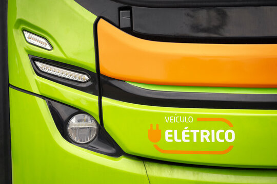 Front view of a bus highlighting the LED headlight assembly, bodywork finish, and electric vehicle identification.