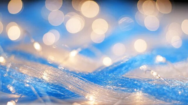 Captivating Sparkle: A Mesmerizing Close-Up of Shimmering Blue and White Textiles Intertwined with Dazzling Lights, Creating an Enchanting Visual Experience