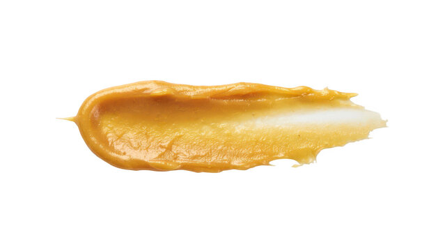 A single smear of creamy peanut butter spread horizontally across the frame, showing a textured surface with visible bits, on black background