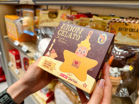 PENANG, MALAYSIA - JUL 03, 2026: Hand holding Pop Mart Twinkle Twinkle Moon Gelato blind box inside retail toy store.
