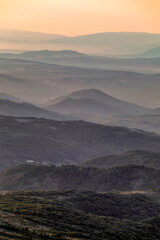 Vertical view of a sunrise over the Las Batuecas-Sierra de Francia Natural Park, viewed from Peña de Francia, Salamanca, Spain. © AntonioLopez
