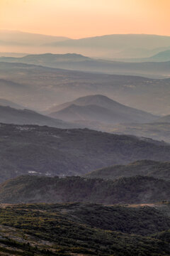 Vertical view of a sunrise over the Las Batuecas-Sierra de Francia Natural Park, viewed from Pe&ntilde;a de Francia, Salamanca, Spain.