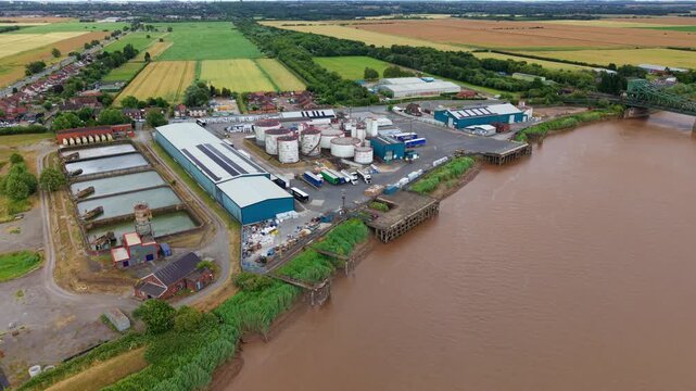 Aerial view of oil storage silos and industrial terminal facility beside the River Trent in Keadby UK