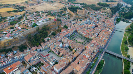 Obraz premium Aerial view of the downtown above the city and Balaguer in Spain, on a sunny spring afternoon.