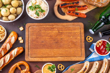 Fototapeta premium Oktoberfest picnic and barbecue food, bavarian party menu, bavarian sausages, pretzels, potato, sauerkraut, beer bottles, with picnic basket, checkered napkin tablecloth, Oktoberfest festive ribbon
