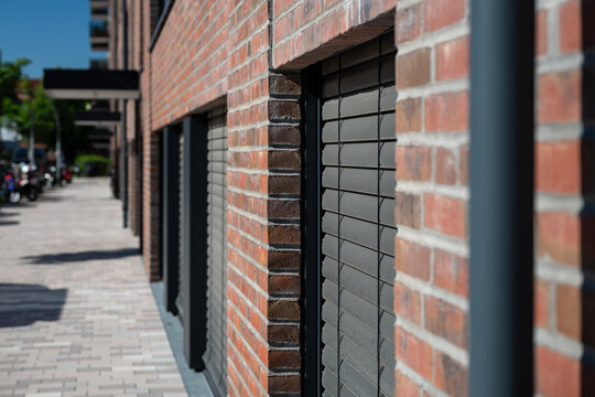 Closeup view of window shutter on street level on a modern building