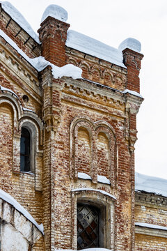 shabby brick tower of abandoned factory building