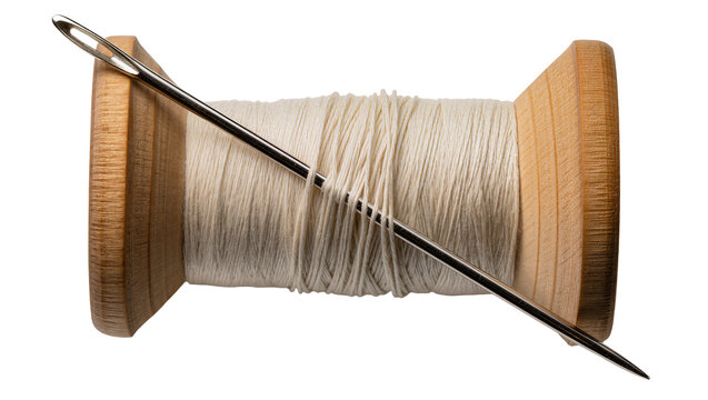 Wooden thread spool with cream thread and metal needle, isolated on transparent background