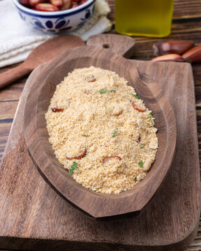 Fafora de pinh&atilde;o, typical brazilian sidedish on a bowl over wooden table