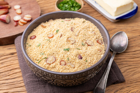 Fafora de pinh&atilde;o, typical brazilian sidedish on a bowl over wooden table