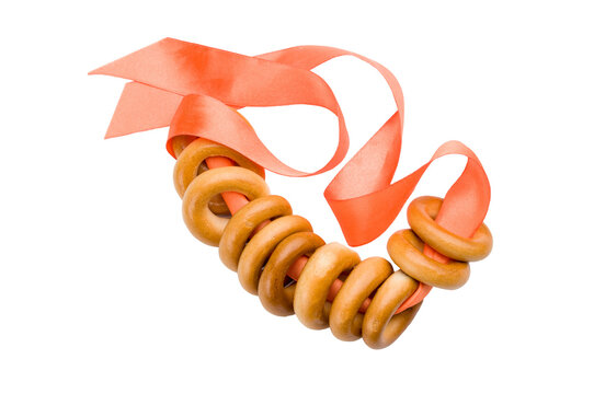 Bublik from Russia or Ukraine with an orange ribbon isolated on white background