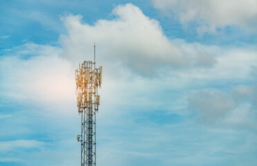 Obraz premium Telecommunication tower with blue sky and clouds. Antenna. Radio and satellite pole. Communication technology. Telecommunication industry. Mobile or telecom 5g network. Telecommunication industry.