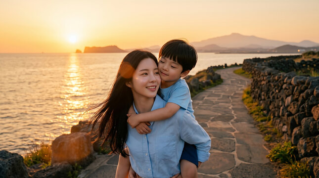 제주 바닷가 노을을 배경으로 한 엄마와 아들 / Mother and Son by Jeju Seaside at Sunset