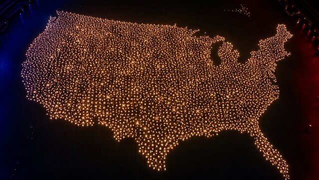 Anonymous light points forming USA map filled with stars from above