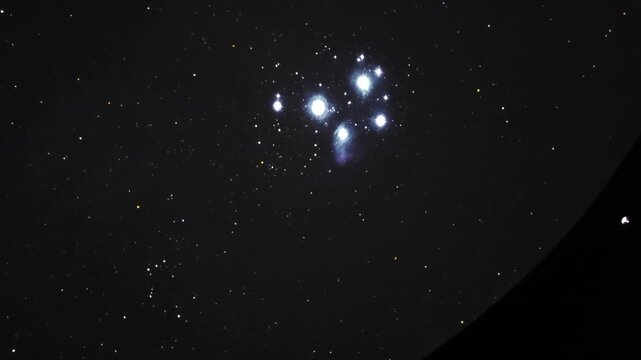 Immersive planetarium dome projection showing planet Saturn, stars constellation map and deep space universe exploration.