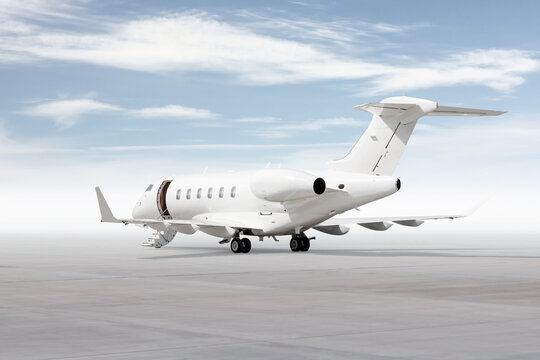 Modern white executive airplane with an opened gangway door isolated on bright background with sky