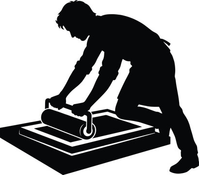 Artist printing artwork with roller, silhouette of person using brayer on silkscreen.
