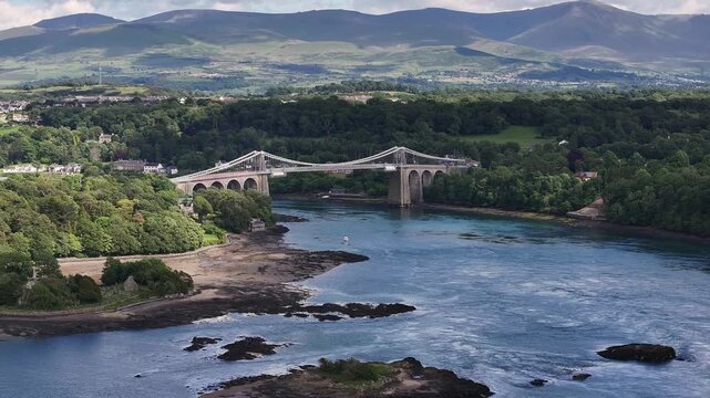 Aerial Video Manai Suspension Bridge.Aerial. Menai Strait, Wales UK.Menai Strait, channel of the Irish Sea separating Isle of Anglesey (Ynys M&ocirc;n) county from the mainland of North Wales. 