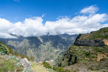 Fototapeta premium Viewpoint in Porto Moniz, Madeira, Portugal. Spectacular panoramic view overlooking the rugged Atlantic coastline, volcanic rock formations, and the scenic beauty of Madeira Island. A breathtaking tra