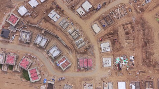 Vertical Aerial View of Active Housing Development Construction Site