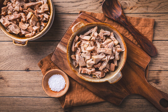 Shredded jackfruit in a bowl, ready for cooking as a meat substitute
