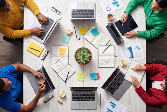 Creative Business Team Brainstorming Around Office Desk
