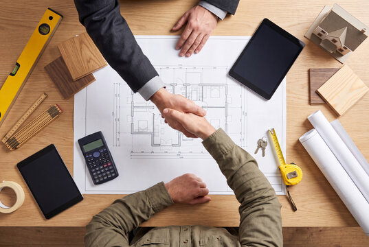 Successful Business Handshake During Construction Project Meeting