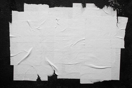 Close-up of white poster with folds.