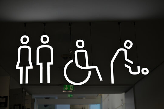 Neon restroom and accessibility icons sign