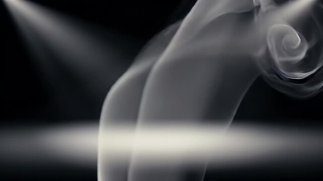 Elegant smoke wisps dance against a dark, dramatic background.