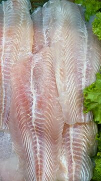 Fresh dory fish with the meat separated from the bones. Saltwater fish fillet.
