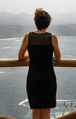Woman admiring seascape from cliff viewpoint in northern spain © JuanFrancisco