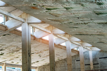 Obraz premium industrial warehouse or commercial area in an architectural background with bare cement pillars supporting a ceiling before construction