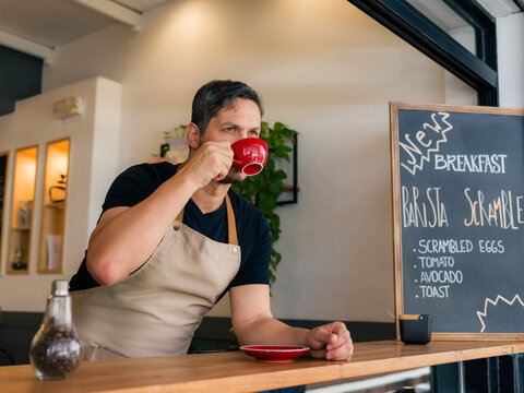 Barista having break at cafe 