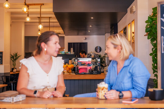 Guests talking while barista working 