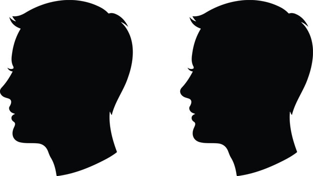 Black silhouette profiles of two human heads facing each other symbolizing communication, dialogue, and social interaction concept design