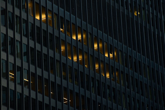 Office Building with Few Lights On at Night 
